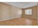Large living room with neutral walls and light colored tile floor offers a clean, modern aesthetic at 8988 Winchester Ridge St, Las Vegas, NV 89139