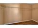 Spacious walk-in closet with wood floors and wire shelving for ample storage at 8988 Winchester Ridge St, Las Vegas, NV 89139