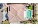 Aerial view of the property showcasing the tile roof, pool, spa, and well maintained backyard at 901 Sir Winston St, Henderson, NV 89052
