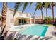Gorgeous backyard with a sparkling pool, spa, and lush landscaping, creating a private oasis at 901 Sir Winston St, Henderson, NV 89052