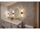 Gorgeous primary bathroom featuring dual sinks, modern lighting, and marble accents at 901 Sir Winston St, Henderson, NV 89052
