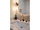 Close up view of an elegant powder room featuring marble countertop, modern fixtures, and vessel sink at 901 Sir Winston St, Henderson, NV 89052