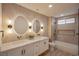Beautifully designed bathroom featuring a dual sink vanity, and shower-tub combo at 901 Sir Winston St, Henderson, NV 89052