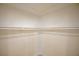 Spacious walk-in closet with ample shelving, offering plenty of room for storage and organization at 901 Sir Winston St, Henderson, NV 89052