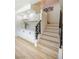 Inviting entryway with custom cabinetry, display shelves and stairs leading to upper level at 901 Sir Winston St, Henderson, NV 89052