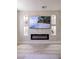 Modern fireplace and TV display with accent shelving in a stylish living room at 901 Sir Winston St, Henderson, NV 89052