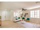 Spacious living room with hardwood floors, neutral tones, and ample natural light at 901 Sir Winston St, Henderson, NV 89052