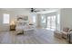 Spacious main bedroom boasts a ceiling fan, light wood floors, and access to a balcony at 901 Sir Winston St, Henderson, NV 89052
