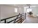 Upstairs office space with modern desk, rug, fan and natural light, easily accessible from the hall at 901 Sir Winston St, Henderson, NV 89052