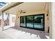 Covered patio with sliding glass doors leading to a backyard oasis with pool and spa at 901 Sir Winston St, Henderson, NV 89052