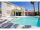 Inviting backyard with a pool, spa, and covered patio, perfect for relaxation and entertainment at 901 Sir Winston St, Henderson, NV 89052