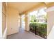 Covered porch with decorative iron railing and view of the landscaped front yard at 901 Sir Winston St, Henderson, NV 89052