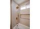 Stylish shower with bronze fixtures, marble wall tiles, and recessed niche at 901 Sir Winston St, Henderson, NV 89052