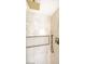 Close up of a luxurious shower with modern fixtures and marble look tile at 901 Sir Winston St, Henderson, NV 89052