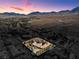 Gorgeous aerial view of estate home with mountains in the background during sunset at 912 Santa Ynez Ave, Henderson, NV 89002