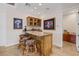 A beautifully appointed bar area featuring granite countertops, wood cabinetry, and stylish seating at 912 Santa Ynez Ave, Henderson, NV 89002