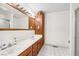 Bathroom featuring a double sink vanity with plenty of cabinets and a glass-enclosed shower at 912 Santa Ynez Ave, Henderson, NV 89002