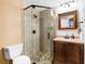 Bathroom featuring a tiled shower, modern fixtures, and a stylish vanity at 912 Santa Ynez Ave, Henderson, NV 89002