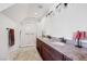 Well-lit bathroom featuring double sinks, granite countertops, and a glass-enclosed shower at 912 Santa Ynez Ave, Henderson, NV 89002