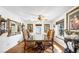Formal dining room featuring a glass table, ornate mirrors, and chandelier lighting at 912 Santa Ynez Ave, Henderson, NV 89002