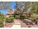 Inviting home entrance with a winding pathway and lush greenery at 912 Santa Ynez Ave, Henderson, NV 89002