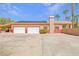 Spacious three-car garage with solar panels providing sustainable energy for the home at 912 Santa Ynez Ave, Henderson, NV 89002