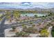 Aerial view showcasing the community, with lush landscaping, a serene lake, and surrounding neighborhood at 1000 E Sunset Rd, Henderson, NV 89011