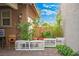 Charming backyard featuring a dog run and greenery, with a cozy pet home, enhancing the outdoor living space at 1000 E Sunset Rd, Henderson, NV 89011
