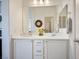 Bright bathroom featuring double sinks, a vanity with solid surface counters, and modern fixtures at 1000 E Sunset Rd, Henderson, NV 89011