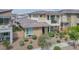 Inviting two-story home featuring a charming balcony, low maintenance landscaping at 1000 E Sunset Rd, Henderson, NV 89011