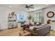 Modern living room with plank floors, ceiling fan, and contemporary decor at 1000 E Sunset Rd, Henderson, NV 89011