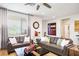 Bright living room featuring wood floors, neutral tones and comfortable seating at 1000 E Sunset Rd, Henderson, NV 89011