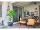 Cozy covered patio with brick pavers and stylish furniture; perfect for outdoor relaxing and entertaining at 1000 E Sunset Rd, Henderson, NV 89011