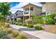 Lovely street view featuring modern homes with balconies, complemented by well-kept landscaping at 1000 E Sunset Rd, Henderson, NV 89011