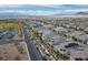 Neighborhood street view showing well-maintained homes and landscaping, offering a glimpse of community living at 1000 E Sunset Rd, Henderson, NV 89011