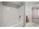 Clean bathroom showcasing a tub and shower combination with white tiled walls at 10001 Peace Way # 2228, Las Vegas, NV 89147