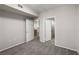 Bedroom with neutral walls and carpeting, and doors leading to the kitchen and bathroom at 10001 Peace Way # 2228, Las Vegas, NV 89147