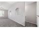 Neutral carpeted bedroom featuring arched accents and a ceiling fan at 10001 Peace Way # 2228, Las Vegas, NV 89147