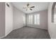 This bedroom boasts large windows and plush carpet at 10001 Peace Way # 2228, Las Vegas, NV 89147