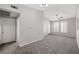 Spacious carpeted room with ceiling fan, bright windows, and neutral paint at 10001 Peace Way # 2228, Las Vegas, NV 89147