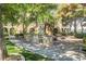 Outdoor community grilling area with picnic tables for dining at 10001 Peace Way # 2228, Las Vegas, NV 89147