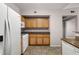Kitchen featuring wooden cabinets and white appliances at 10001 Peace Way # 2228, Las Vegas, NV 89147