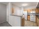 Kitchen featuring light colored cabinets and breakfast bar at 10001 Peace Way # 2228, Las Vegas, NV 89147