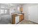 Spacious kitchen with white sink and dishwasher and oak cabinetry at 10001 Peace Way # 2228, Las Vegas, NV 89147