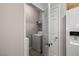 Laundry room with white appliances and a white door in the kitchen at 10001 Peace Way # 2228, Las Vegas, NV 89147
