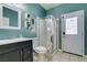 Bathroom with step-in shower, vanity, and tile flooring at 1048 Painted Daisy Ave, Henderson, NV 89074