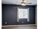 Bedroom with wood-look flooring, ceiling fan, a window, and neutral paint at 1048 Painted Daisy Ave, Henderson, NV 89074