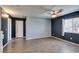 Bedroom with wood-look flooring, ceiling fan, a window, and neutral paint at 1048 Painted Daisy Ave, Henderson, NV 89074