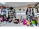 Walk-in closet with shelves and hanging rods for ample storage at 1048 Painted Daisy Ave, Henderson, NV 89074