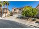Charming two-story home features a three-car garage and shade tree at 1048 Painted Daisy Ave, Henderson, NV 89074